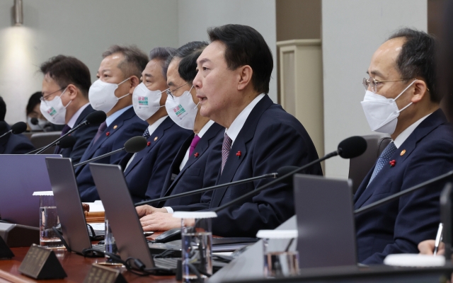 President Yoon Suk-yeol presides over a Cabinet meeting at the presidential office in Seoul on Tuesday morning. (Yonhap)