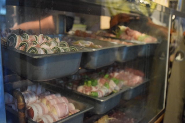 Skewers are stacked on one side of the kitchen shelves waiting to be cooked at Gu-un restaurant (Kim Hae-yeon/ The Korea Herald)