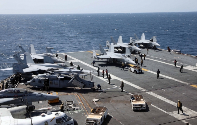 This photo, taken on Monday, shows the flight deck of the USS Nimitz aircraft carrier engaging in drills with the South Korean Navy in waters south of the Korean Peninsula. (Yonhap)