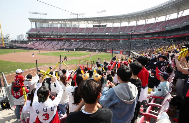 Fans take in a Korea Baseball Organization preseason game between the home team Kia Tigers and the NC Dinos at Gwangju-Kia Champions Field in Gwangju, some 270 kilometers south of Seoul, last Sunday. (Yonhap)