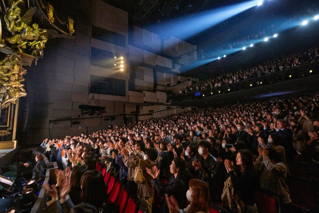 The audience gives a standing ovation after 