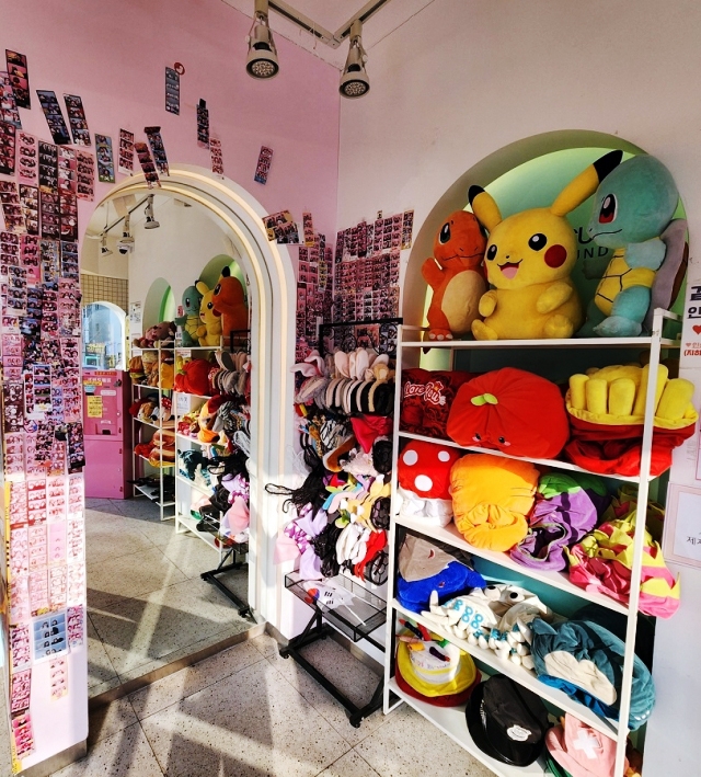 Hats, headbands and other props are stacked up on shelves inside a self-service instant photo studio. (Choi Jae-hee / The Korea Herald)