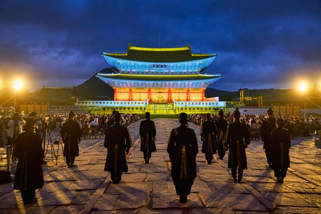 Actors wait to enter the stage during a performance of 