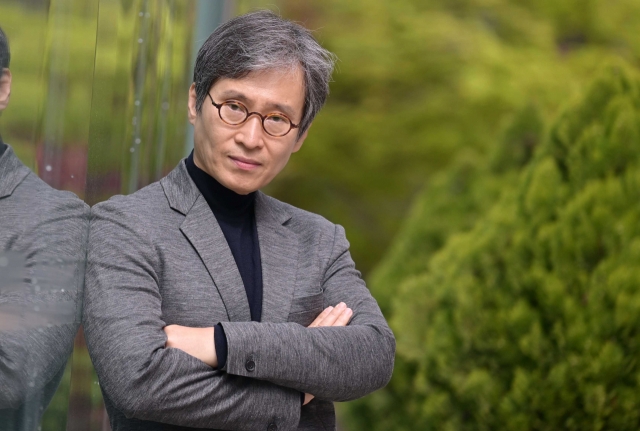 Novelist Lee Jung-myung poses for a photo during an interview with The Korea Herald in Seocho-gu, southern Seoul, in April. (Lee Sang-sub/The Korea Herald)