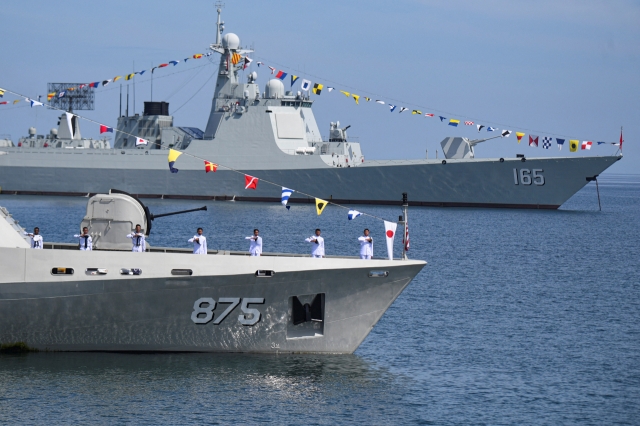 Indonesian Navy stand on the deck of Indonesia's Naval ship KRI Bawal-875 during the International Fleet Review part of the Multilateral Naval Exercise Komodo 2023 event in the Makassar Sea, South Sulawesi province, Indonesia. (Reuters-Yonhap, photo provided by a third party)