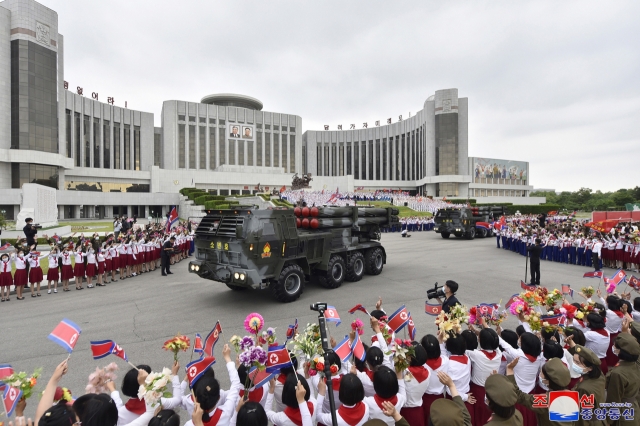 This photo from Wednesday, shows multiple rocket launchers donated by the Korean Children's Union moving along outside Mangyongdae Schoolchildren's Palace in Pyongyang the previous day. (KCNA)