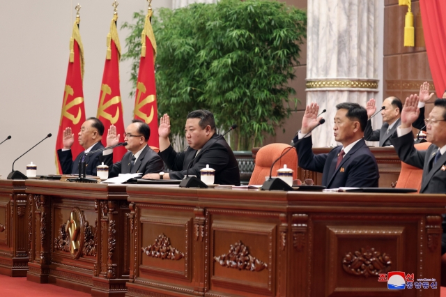 This photo shows a plenary meeting of the 8th Central Committee of the ruling Workers' Party of Korea taking place, with leader Kim Jong-un in attendance on Monday. (KCNA)