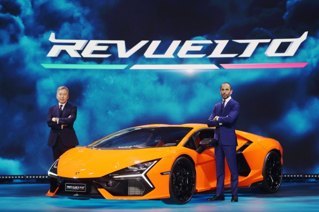 Lee Jong-bok (from left), head of Lamborghini Korea, and Francesco Scardaoni, Asia Pacific regional director of Lamborghini, pose for a photo after a press conference at Times Aerospace Korea in Gimpo on Friday. (Lamborghini Korea)