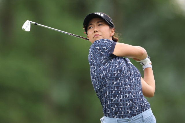 In this Associated Press photo, Jenny Shin of South Korea tees off on the 12th hole during the third round of the KPMG Women's PGA Championship at Baltusrol Golf Club in Springfield, New Jersey, on Saturday. (Yonhap)