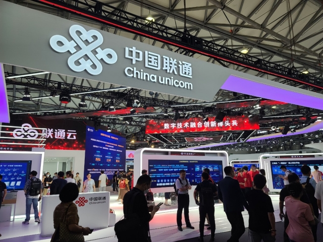 Visitors look around exhibition booths at the MWC Shanghai 2023, at Shanghai New International Expo Center, in Shanghai on Wednesday. (Jie Ye-eun/The Korea Herald)