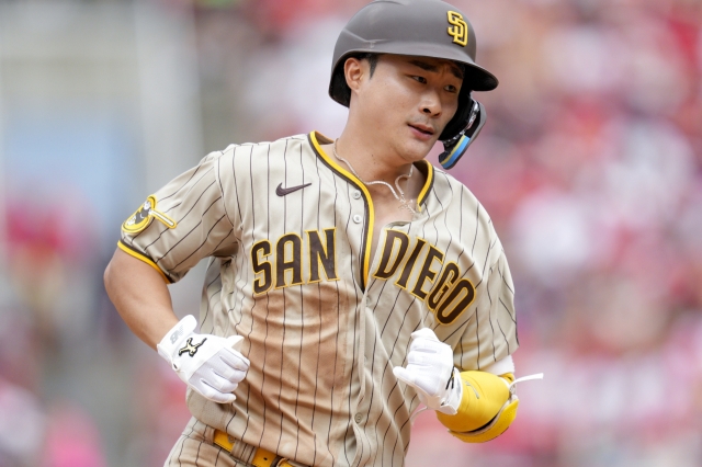 San Diego Padres' Ha-Seong Kim rounds the bases after hitting a solo home run during the eighth inning of a baseball game against the Cincinnati Reds Sunday in Cincinnati. (AP Photo/Jeff Dean)