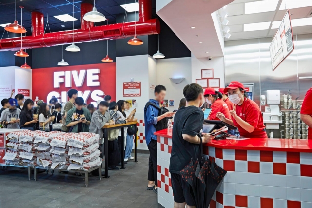 Customers wait in line to order at Five Guys in Gangnam-gu, southern Seoul. (FG Korea)