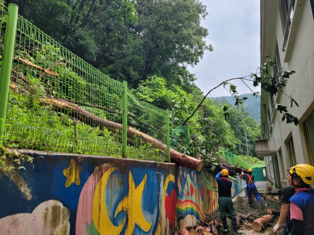 A fence in a school is severely damaged following torrential rain. (Gangwon Provincial Office of Education)