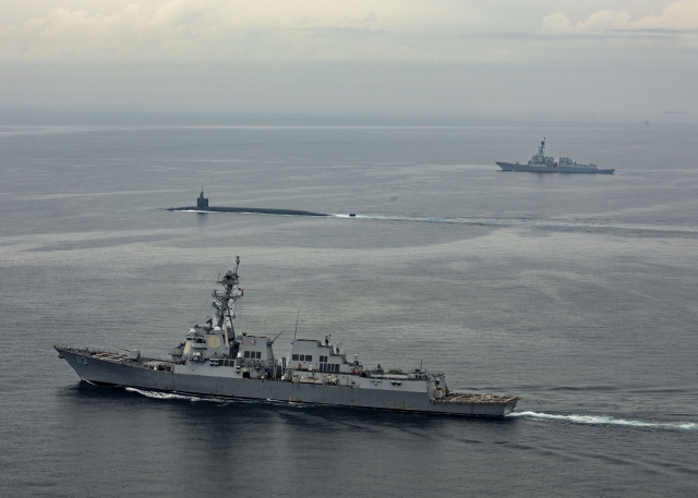 The Ohio-class ballistic-missile submarine USS Kentucky (SSBN 737) proceeds on the surface to Busan for a port visit while escorted by Arleigh Burke-class guided-missile destroyers USS John Finn (DDG 113) and USS Ralph Johnson (DDG 114) on Tuesday. (Photo - US Navy)