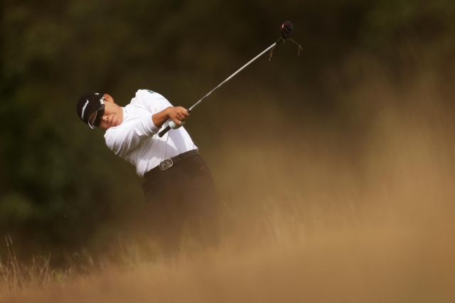 Shin Ji-yai of South Korea hits a shot on the fourth hole during the final round of the AIG Women's Open at Walton Heath Golf Club in Surrey, England, on Monday. (The Royal and Ancient Golf Club)