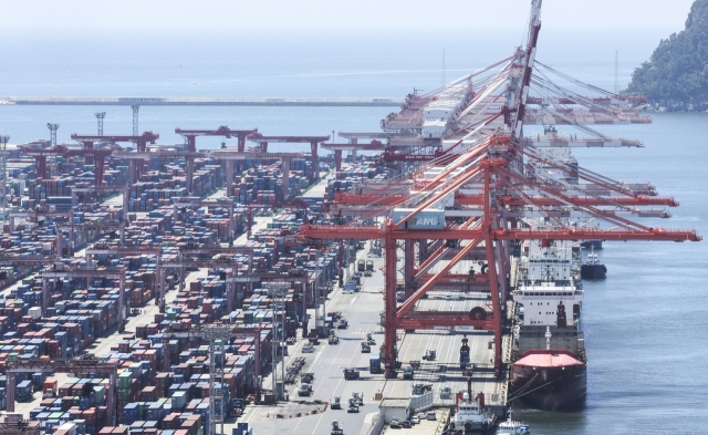 Containers are stacked at a pier in the southeastern port city of Busan on June 12. (Yonhap)