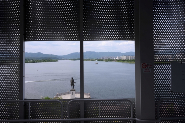 An opening looks out to the statue of Maiden of Soyanggang. (Lee Sang-sub/ The Korea Herald)