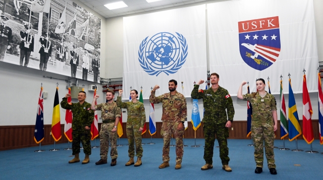 Five augmentees and one staff member from the five member states of the United Nations Command pose for a group photo during an interview on Aug. 30 at the headquarters of the UNC located within Camp Humphreys, the US base in the city of Pyeongtaek, Gyeonggi Province. (Korea Herald/ Pool Photo)