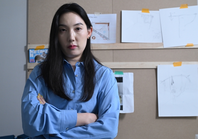 Woo Hannah poses for a photo at her studio in Seoul on Aug. 18. (Im Se-jun/The Korea Herald)