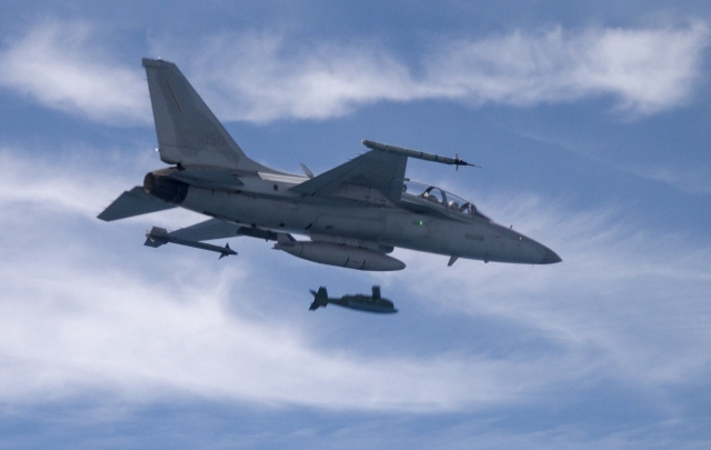 A South Korean F-15K fighter jet fires a GBU-56 air-to-surface missile at a target in the Yellow Sea on August 31, in this photo provided by the Air Force.