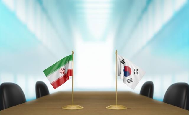 The South Korean (right) and Iranian flags. (123rf)