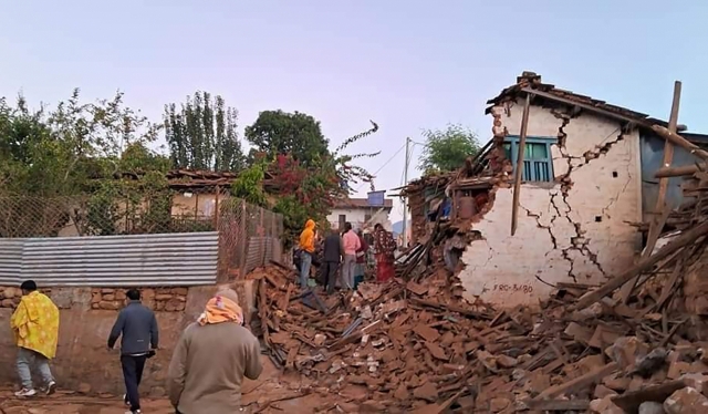 This handout photo provided by Nepal Prime Minister's Office shows an earthquake-affected area in northwestern Nepal, Saturday. Helicopters and ground troops rushed to help people hurt in a strong earthquake that shook northwestern Nepal districts just before midnight Friday, killing more than 100 people and injuring dozens dozens more, officials said Saturday. (Nepal Prime Minister's Office via AP)