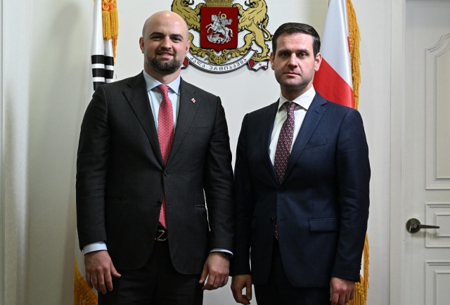 Genadi Arveladze, the Deputy Minister of Economy and Sustainable Development of Georgia, and Georgian Ambassador to Korea Tarash Papaskua pose for a photo ahead of an interview with The Korea Herald at the Embassy of Georgia in Yongsan-gu, Seoul on Friday. (Im Se-jun/The Korea Herald)