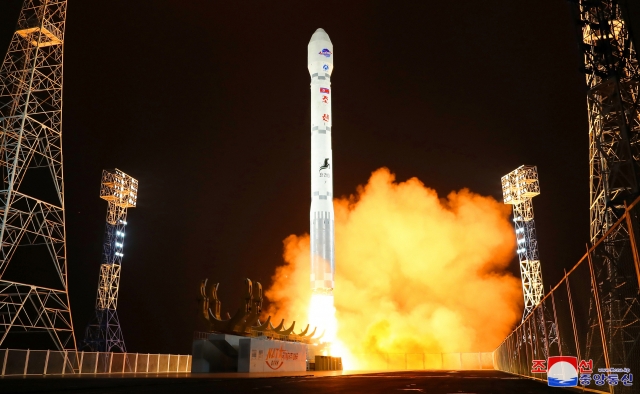 This file photo on Nov. 22, shows the North launching a military spy satellite, called the Malligyong-1, on a new type of Chollima-1 rocket the previous day. (Yonhap)