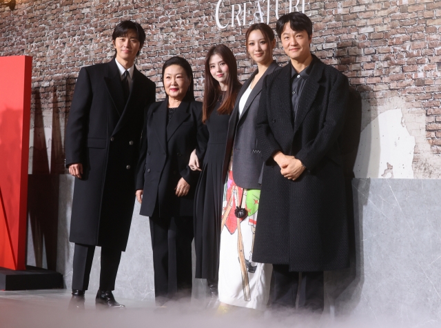 From left: The cast of Netflix's “Gyeongseong Creature,” including Park Seo-joon, Kim Hae-sook, Han So-hee, Claudia Kim and Cho Han-cheol, pose for a photo during a press conference held in Yongsan-gu, Seoul, Tuesday. (Yonhap)