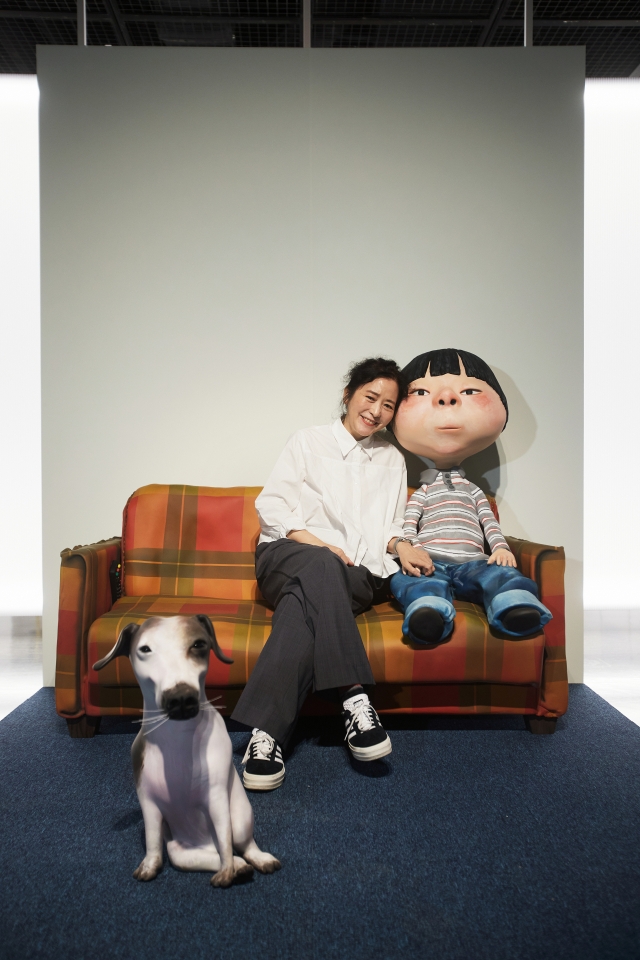 Picture book artist Baek Hee-na poses for photos after a press conference held at Seoul Arts Center's Hangaram Art Museum in June. (Seoul Arts Center)