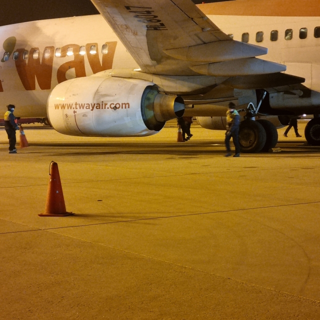 This photograph shows the TW216 flight after it landed at Incheon Airport on Wednesday, minutes after a bird hit one of its engines. (Yonhap)