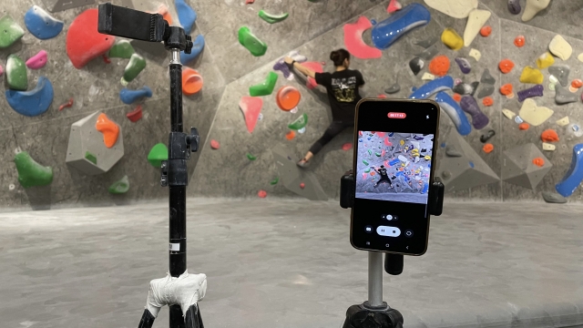 A visitor records their climb on their smartphone. (Amber Anne Roos/The Korea Herald)