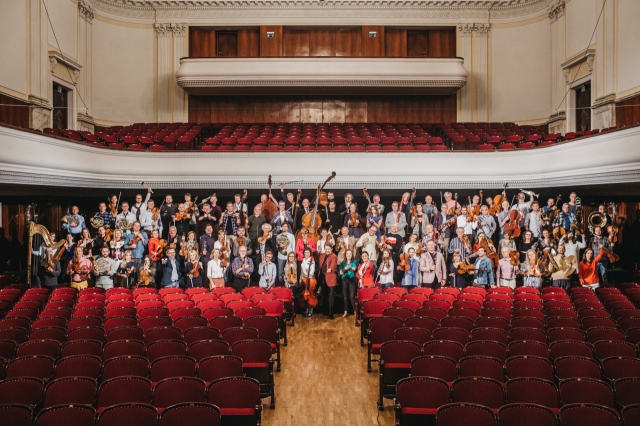 Members of the Warsaw Philharmonic Orchestra pose for photos. (Grzesiek Mart)