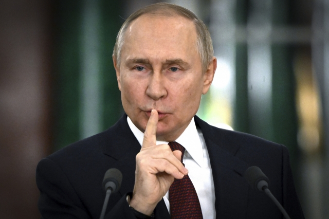 Russian President Vladimir Putin gestures while speaking at a news conference following a meeting of the State Council at the Kremlin in Moscow, Russia on Thursday, Dec. 22, 2022. (File Pool Photo via AP)