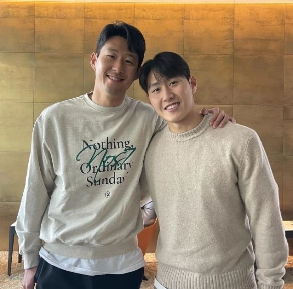 This photo posted on official Instagram page of Son Heung-min shows Son (left) and Lee Kang-in posing for a photo. (Son Heung-min's Instagram page)