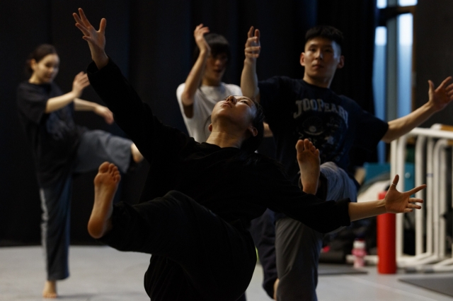 Dancers rehearse a scene from 