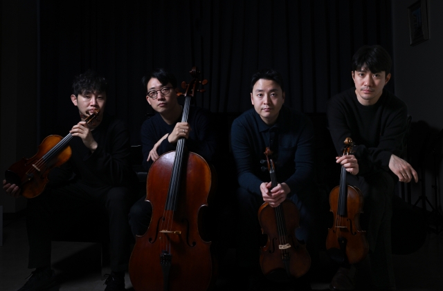 (From left) Members of the Novus String Quartet -- violinist Kim Jae-young, cellist Lee Won-hae, violist Kim Kyu-hyun and violinist Kim Young-uk -- pose for photos during an interview with The Korea Herald on Monday. (Im Se-jun/The Korea Herald)