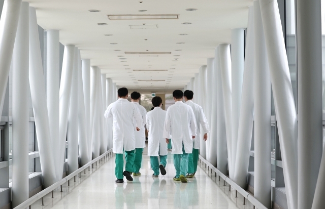 A group of doctors are seen at a hospital in Seoul, Tuesday. (Yonhap)