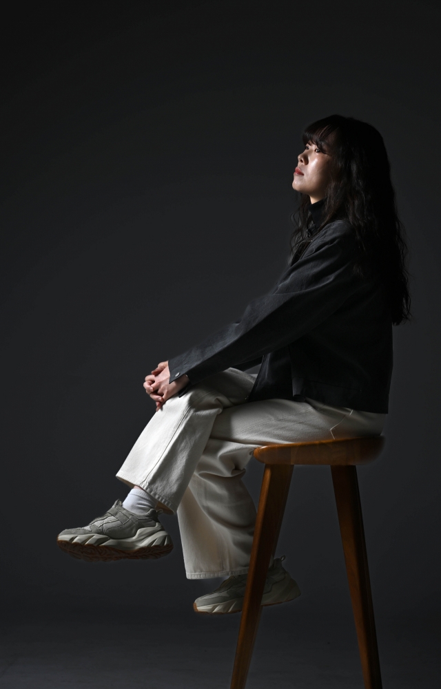 Singer-songwriter Kim Sawol poses for a photo during an interview with The Korea Herald, in Seoul, March 5. (Lee Sang-sub/The Korea Herald)