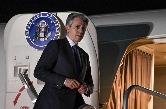 US Secretary of State Antony Blinken boards his plane upon departure from Norman Manley International Airport, in Kingston, Jamaica, on Monday. (AFP)