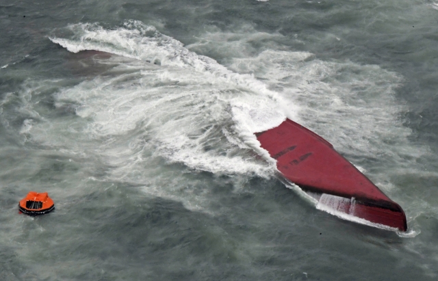 A South Korean chemical tanker is overturned in waters off Japan's western city of Shimonoseki, Yamaguchi prefecture, Wednesday. (Yonhap-AP)