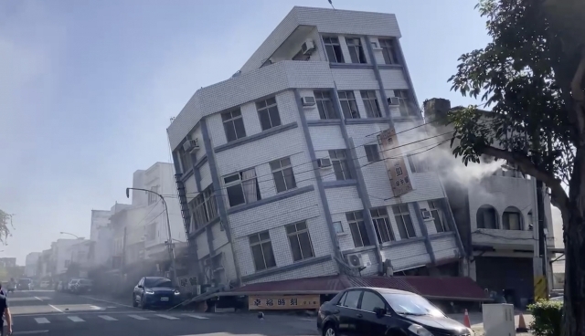 In this image taken from a video footage, a partially collapsed building is seen in Hualien, eastern Taiwan on Wednesday. A powerful earthquake rocked the entire island of Taiwan early Wednesday, collapsing buildings in a southern city and creating a tsunami that washed ashore on southern Japanese islands. (TVBS)