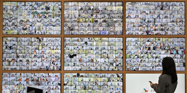 An official monitors security camera screens showing locations designated for ballot box storage at the election situation room of the National Election Commssion in Gwacheon, Gyeonggi Province, Tuesday, one day prior to the general election. (Im Se-jun/The Korea Herald)