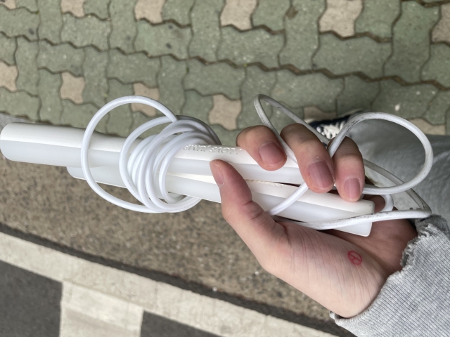 Voter Shin Min-kwon, a 29-year-old Seoul resident, takes a photo of his stamped hand holding a jumping rope. (Shin Min-kwon)