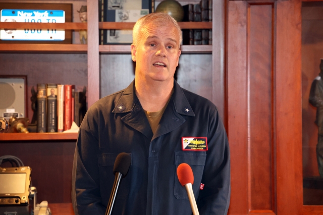 Rear Adm. Christopher Alexander, commander of the Strike Group Nine, speaks to reporters aboard the USS Theodore Roosevelt on Thursday.