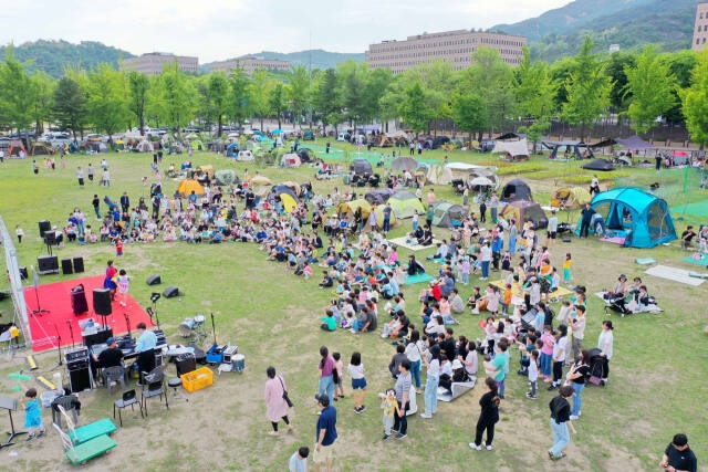 The audience enjoys a concert during 