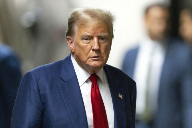 Former President Donald Trump leaves the courtroom following the day's proceedings in his trial at Manhattan Criminal Court in New York on Tuesday, (Pool Photo via AP)