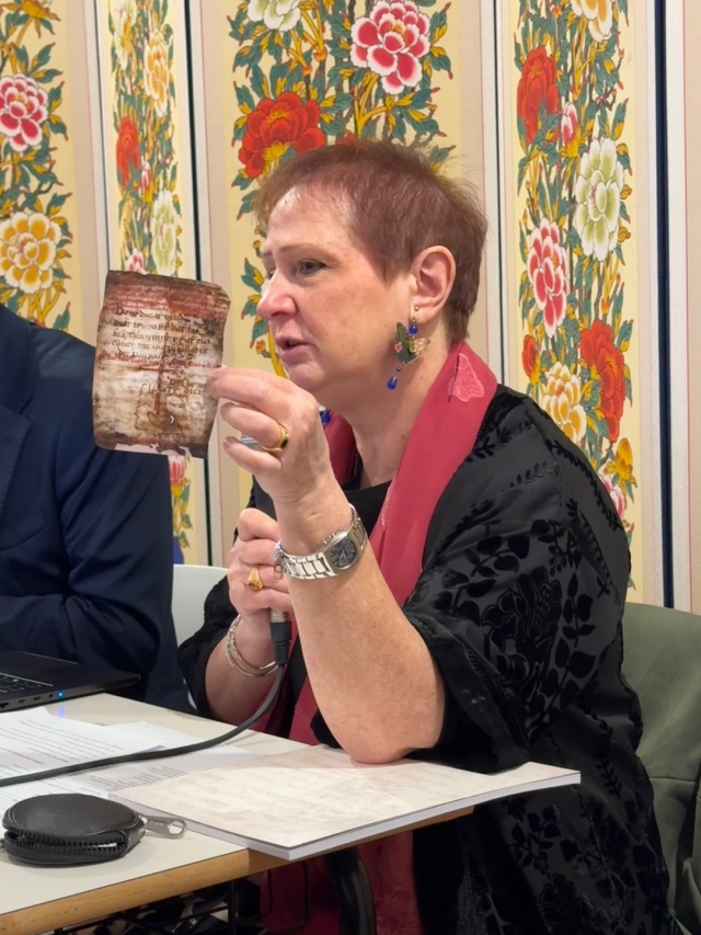 Maria Letizia Sebastiani presents a copy of the Chartula, prayers written on parchment by St. Francisco of Assisi in 1224, which were restored using 