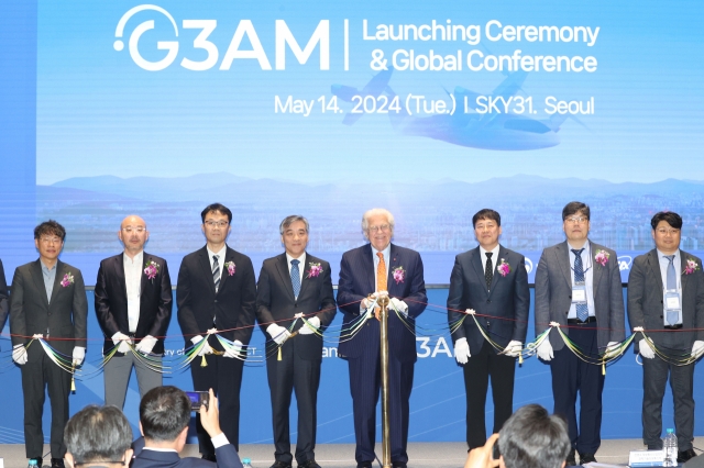 Officials pose for a photo at the launch ceremony of the Global Association for Advanced Air Mobility at Lotte World Tower in Seoul on Tuesday. (Yonhap)