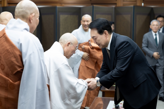 President Yoon Suk Yeol participates in a celebration event held at the Jogye Temple in central Seoul on Wednesday. (Yonhap)